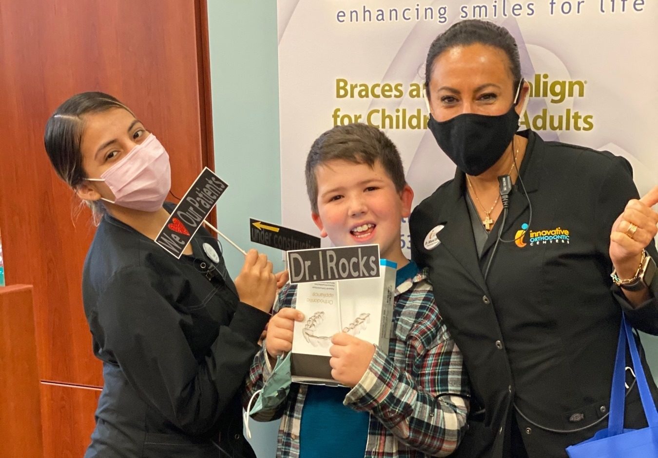 Dr. Manal Ibrahim celebrating with a patient who recently finished dentofacial orthopedics in Naperville