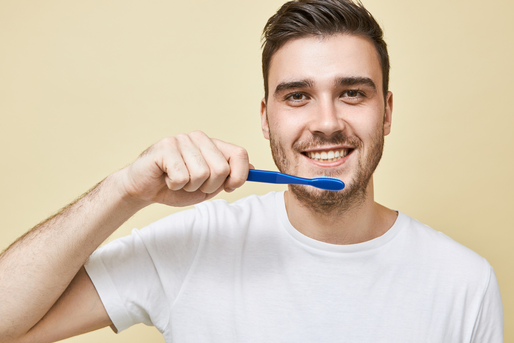 Brushing twice a day with a soft-bristled toothbrush